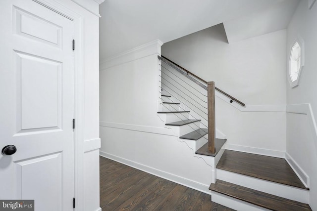 stairs featuring baseboards and wood finished floors