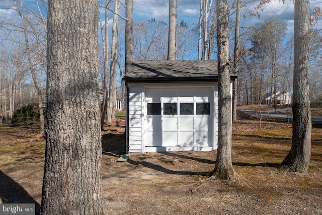 view of outbuilding with an outbuilding and dirt driveway