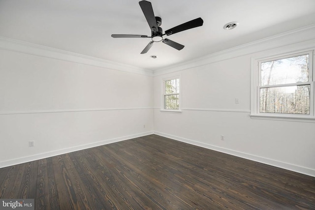 unfurnished room featuring ceiling fan, visible vents, baseboards, dark wood-style floors, and crown molding