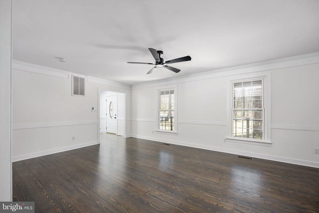 unfurnished living room with crown molding, visible vents, ceiling fan, wood finished floors, and baseboards