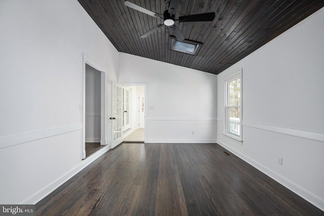 spare room with lofted ceiling, ceiling fan, wood finished floors, wood ceiling, and baseboards