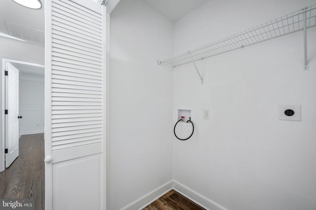 laundry room with laundry area, baseboards, dark wood finished floors, washer hookup, and electric dryer hookup