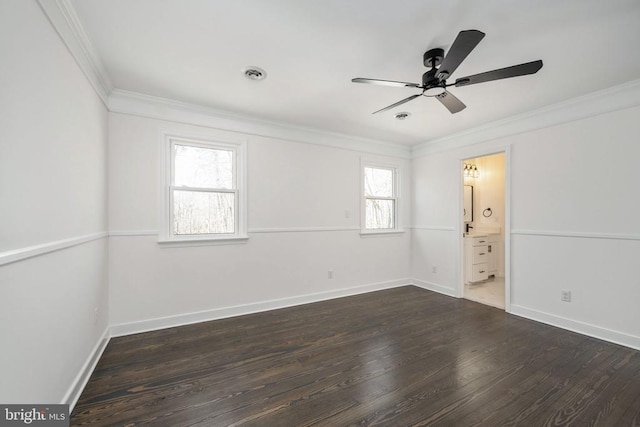 unfurnished bedroom featuring baseboards, visible vents, ensuite bath, ornamental molding, and dark wood-style flooring