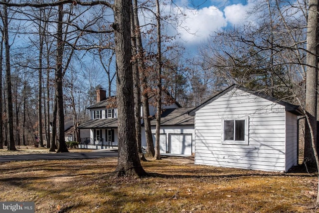 view of front of house with a chimney