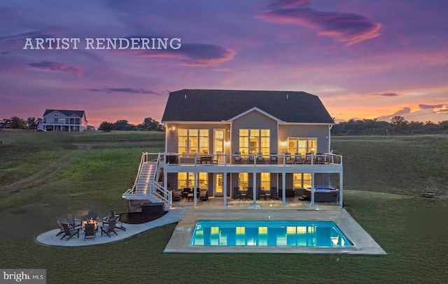 back house at dusk featuring a patio, a balcony, and an outdoor fire pit