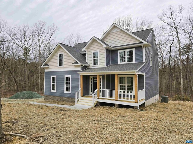 view of front facade with central AC unit and covered porch