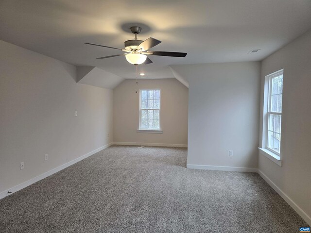 bonus room with lofted ceiling, light colored carpet, and ceiling fan