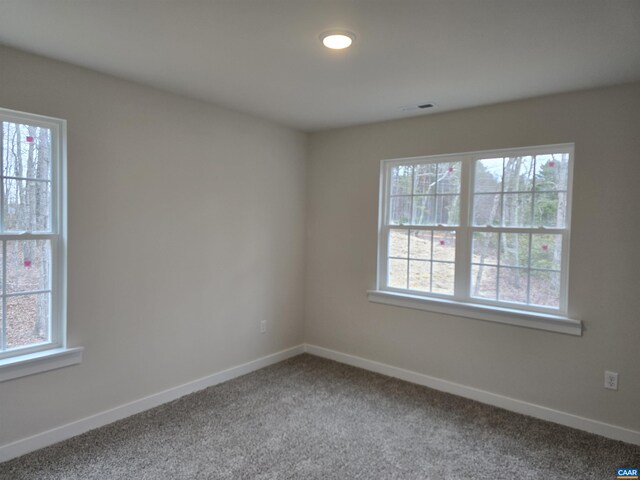 empty room with carpet flooring