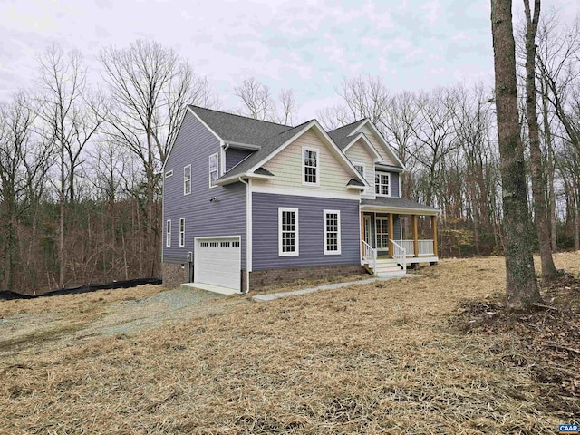 view of front property with a garage and covered porch