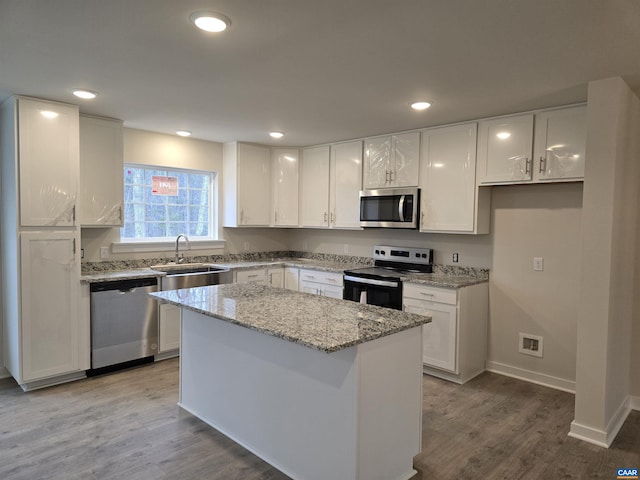 kitchen with stainless steel appliances and white cabinetry