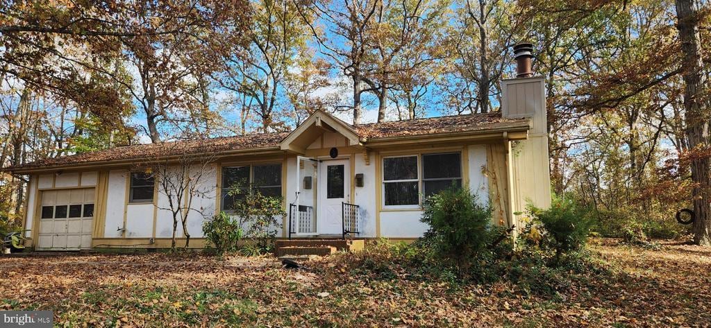 single story home with a garage