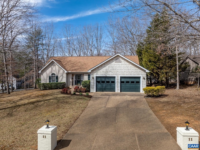 ranch-style home featuring concrete driveway, an attached garage, a front yard, and roof with shingles