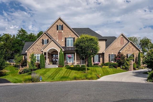 craftsman-style house with a front lawn