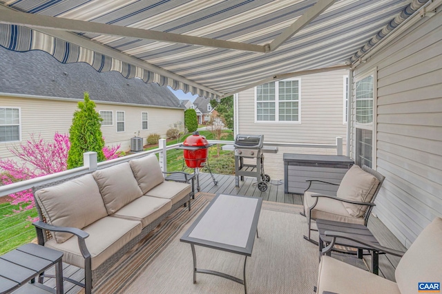 wooden terrace featuring a jacuzzi, outdoor lounge area, cooling unit, and area for grilling