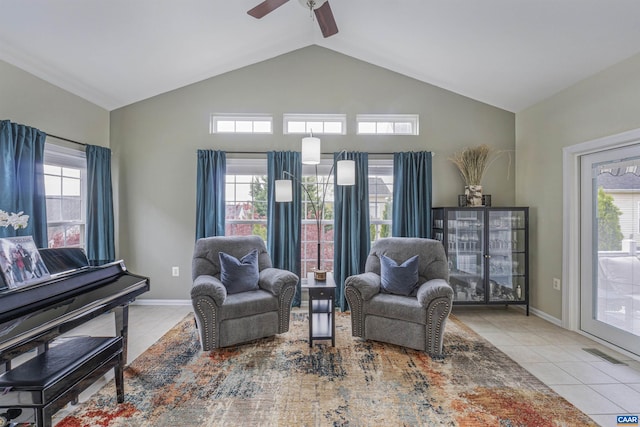 sitting room with a wealth of natural light, a ceiling fan, and visible vents