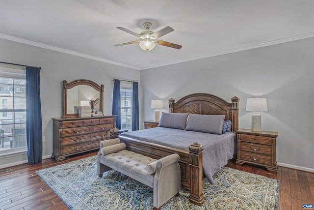 bedroom with visible vents, baseboards, ceiling fan, hardwood / wood-style flooring, and ornamental molding