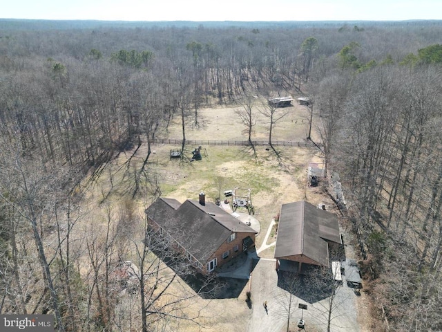 aerial view with a rural view and a wooded view