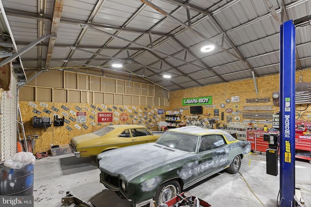 garage featuring metal wall and a workshop area