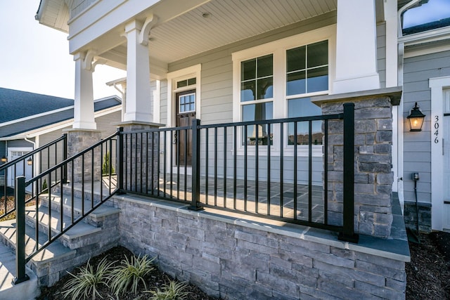 property entrance with covered porch