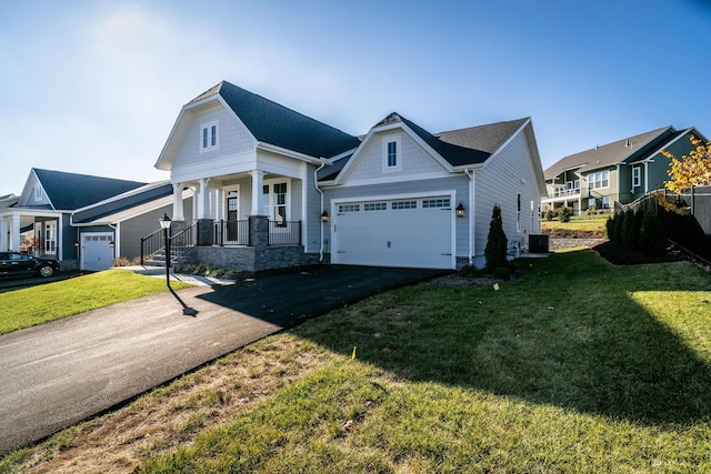 view of front of house featuring central AC, aphalt driveway, a front lawn, and a porch