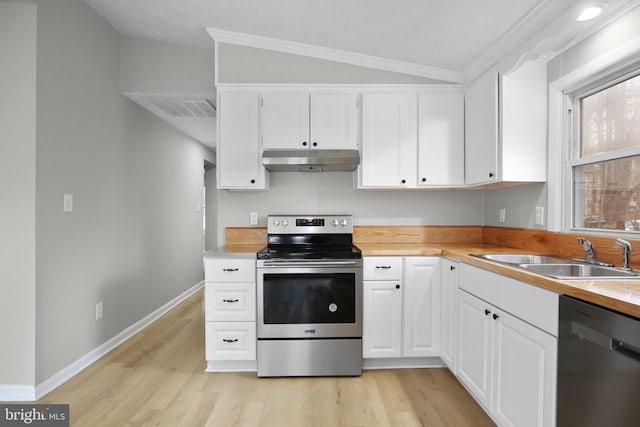 kitchen with ornamental molding, stainless steel appliances, light wood-type flooring, under cabinet range hood, and a sink