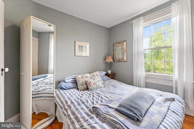 bedroom with wood-type flooring