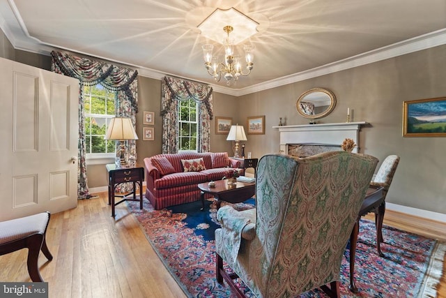 living room with an inviting chandelier, light hardwood / wood-style flooring, and ornamental molding