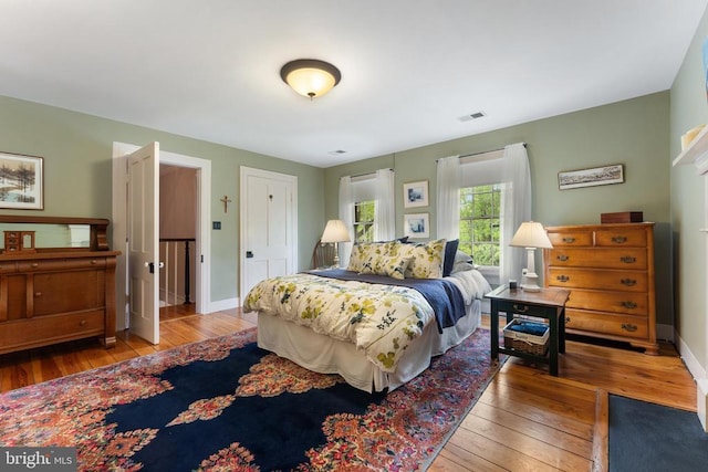 bedroom with hardwood / wood-style floors