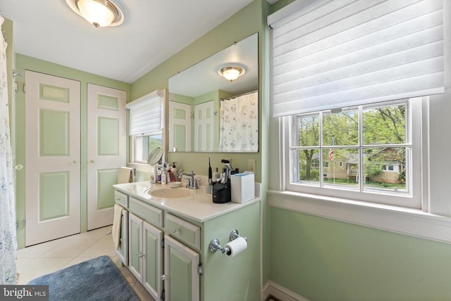 bathroom featuring tile patterned floors and vanity