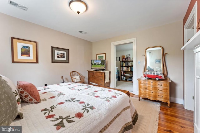 bedroom with wood-type flooring