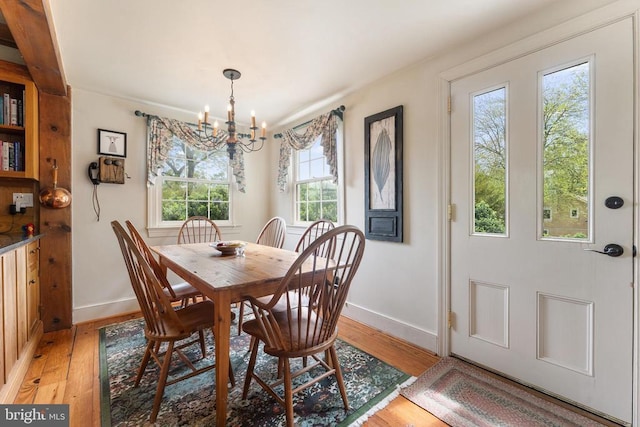 dining room featuring a chandelier and light hardwood / wood-style floors