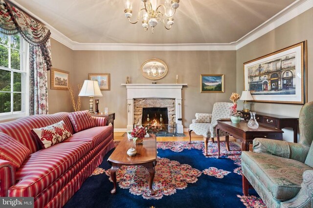 living room featuring ornamental molding and a notable chandelier