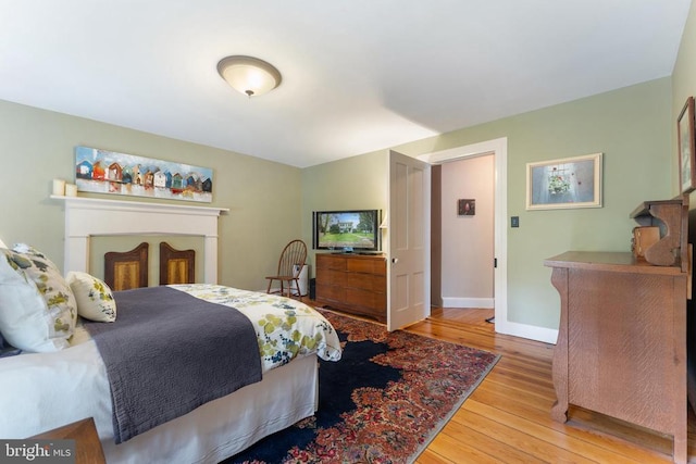 bedroom with light hardwood / wood-style floors