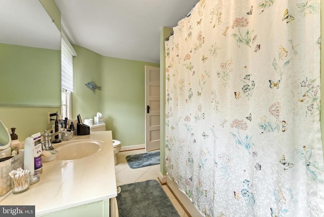 bathroom with a shower with curtain, vanity, toilet, and tile patterned flooring