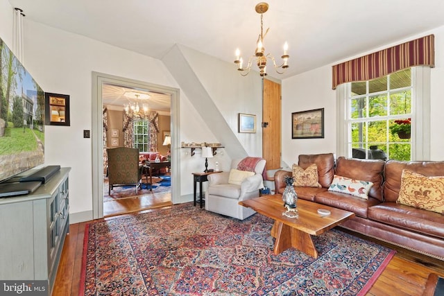 living room featuring dark hardwood / wood-style flooring and a chandelier