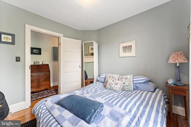 bedroom with wood-type flooring