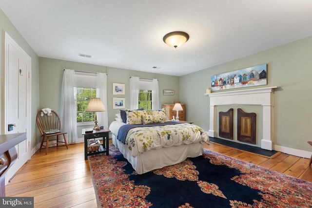 bedroom with light wood-type flooring