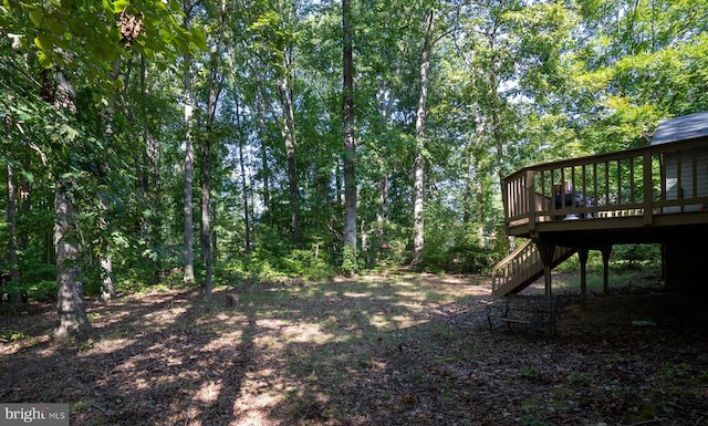 view of yard with a wooden deck