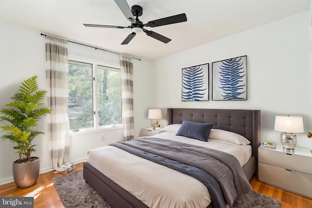 bedroom with ceiling fan and light wood-type flooring