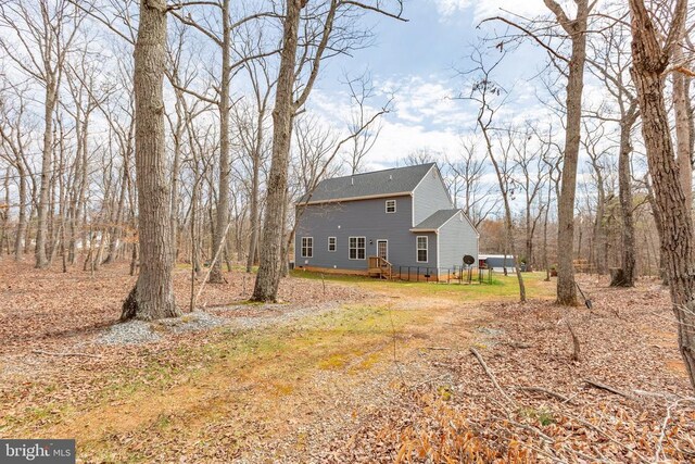 back of property featuring a wooden deck