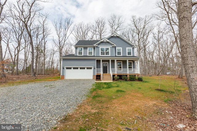 view of front of property with gravel driveway, a porch, and a front lawn