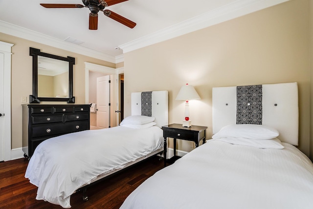 bedroom with crown molding, dark wood-type flooring, and ceiling fan