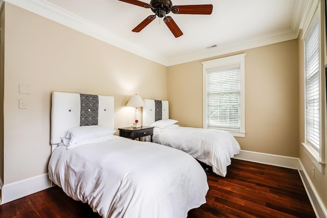 bedroom with multiple windows, crown molding, dark hardwood / wood-style flooring, and ceiling fan