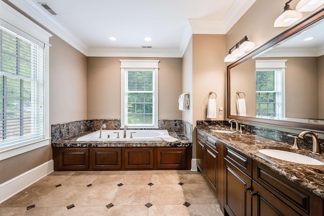 bathroom with vanity, crown molding, and a tub