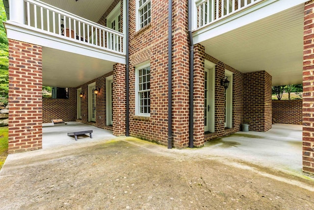 exterior space featuring a balcony and a patio