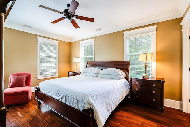 bedroom featuring multiple windows, crown molding, and dark wood-type flooring