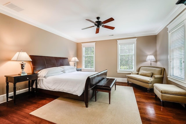 bedroom featuring ornamental molding, dark hardwood / wood-style floors, and ceiling fan