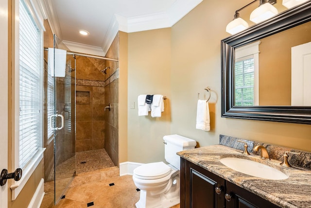 bathroom featuring tile patterned floors, toilet, crown molding, vanity, and a shower with door