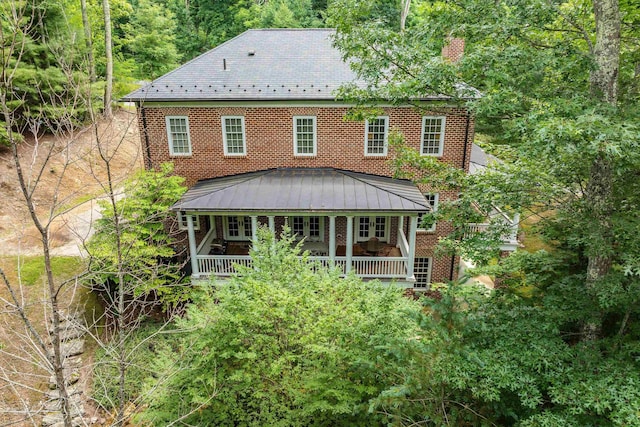 rear view of house with a porch