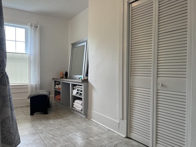 hallway with light tile patterned floors